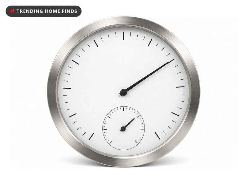 A large round outdoor dial thermometer with a stainless steel rim, a glass lens and a black needle.