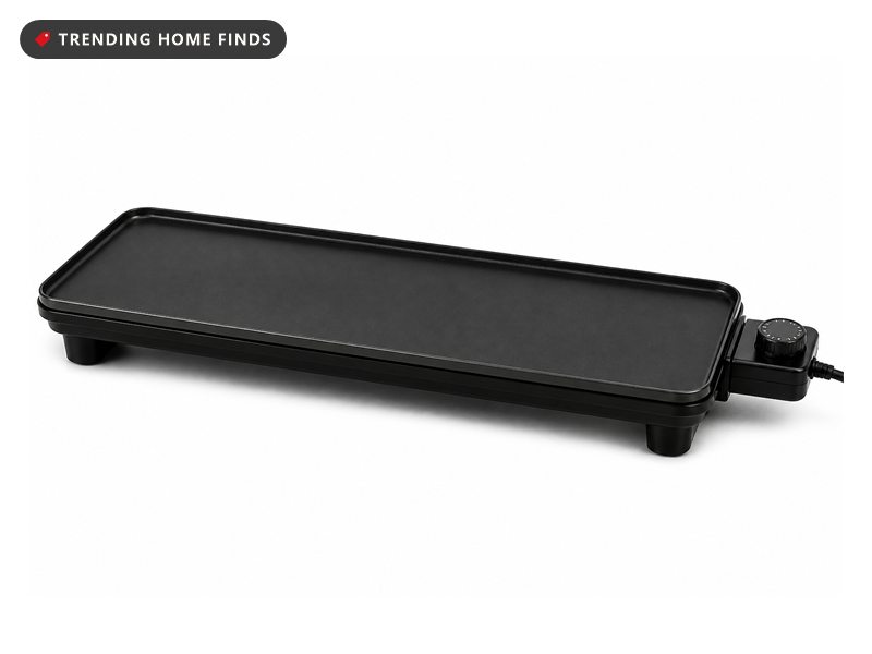 A long black electric griddle with a nonstick surface and a detachable temperature control.