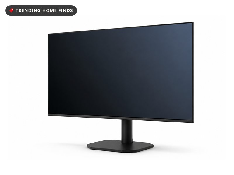 A thin flat monitor with slim black bezels on a slender column and a flat hexagonal foot.