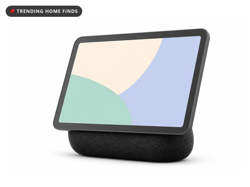 A graphite smart display with an 8.7 inch screen on a rounded fabric speaker base.
