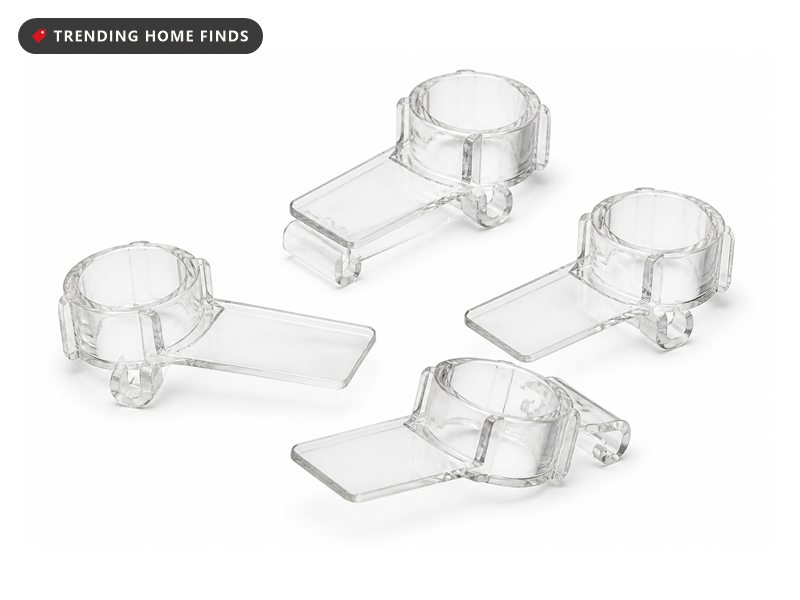 A small group of clear plastic all in one light clips with gutter hooks and shingle tabs.