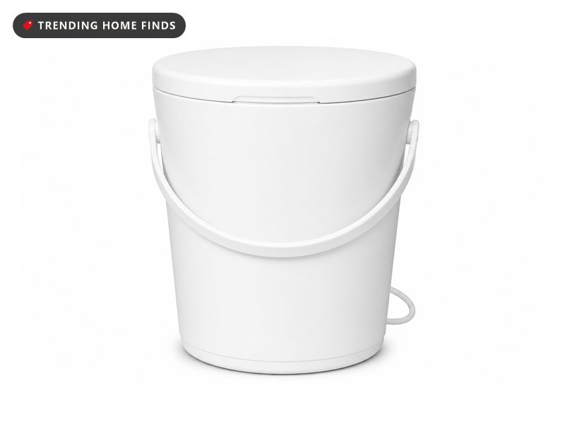 A tall round white bucket towel warmer with a hinged lid, a side handle and a short cord.