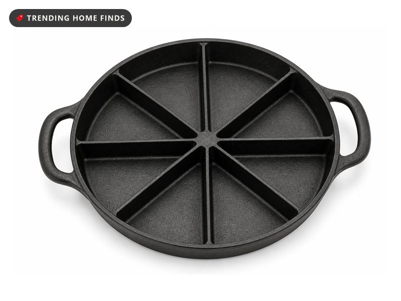 A round black cast iron pan divided into eight wedge shaped wells, with a loop handle on each side.