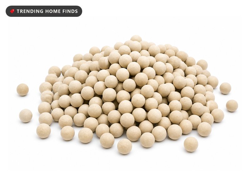 A loose mound of small round pale tan stoneware pie weights.