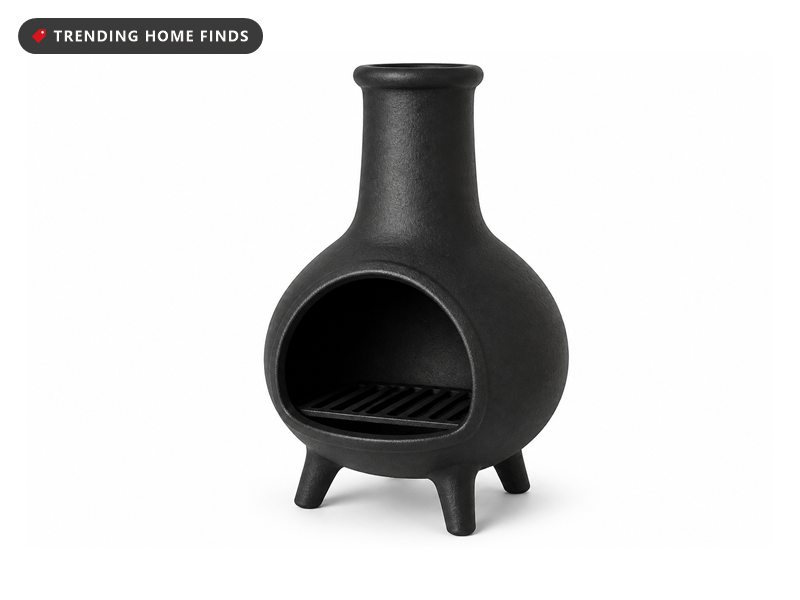 A black cast chiminea with a bulbous fire bowl under a narrow tapered chimney.