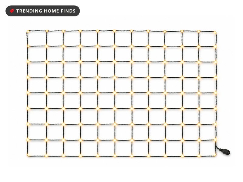 A rectangular net of thin dark wire with small warm white lights at every crossing, laid out flat.