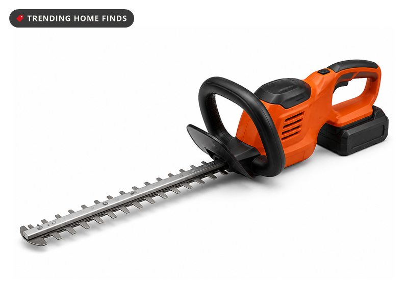 An orange and black cordless hedge trimmer with a long steel blade and a battery pack.