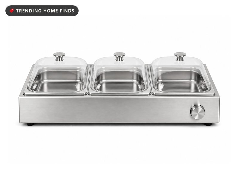 A brushed stainless steel buffet server with three lidded pans on a low heated base.