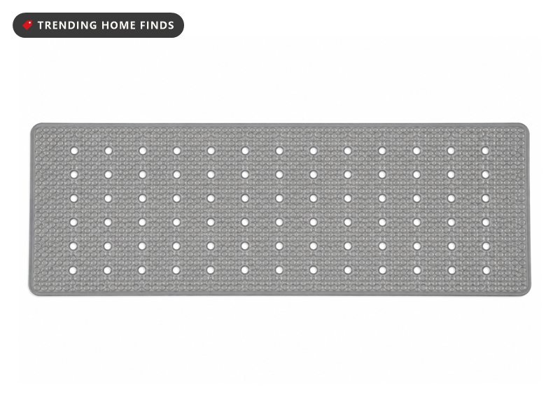 A long translucent gray non slip bath mat with rows of small round drain holes.