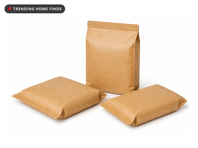 Three small sealed kraft paper pouches of fire color changing powder, one standing and two lying flat.