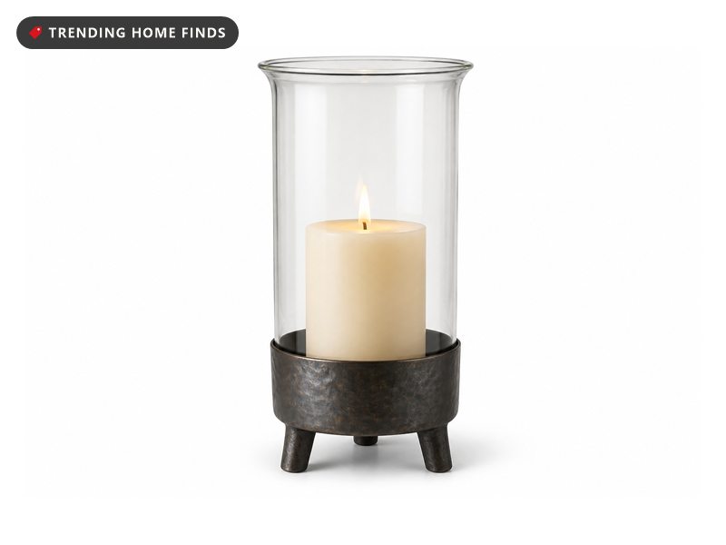 A 10 inch clear glass hurricane candle holder with a rustic metal insert at its base.