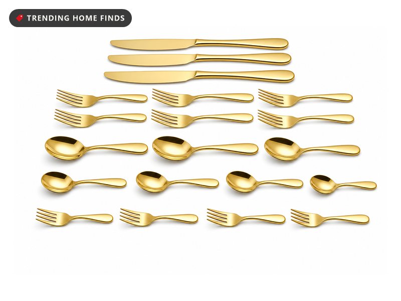 A twenty piece gold flatware set laid out in rows: knives, forks, spoons, teaspoons and salad forks.