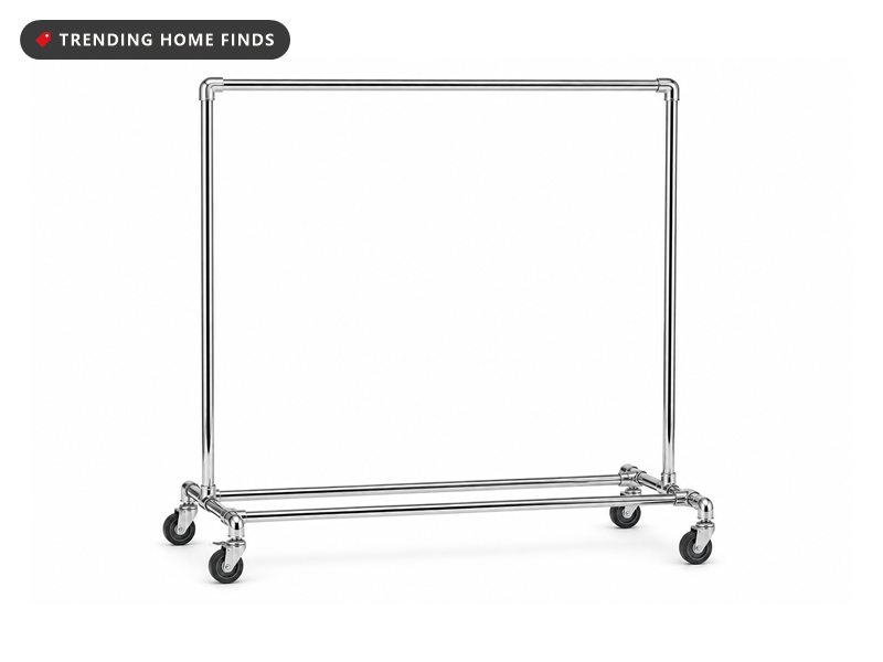 A chrome rolling garment rack with a hanging rail on two side posts and four wheels.