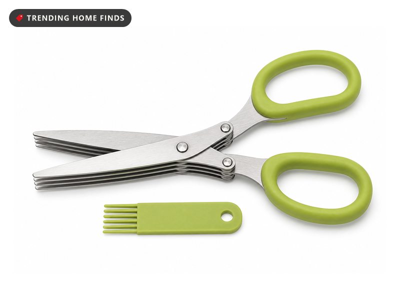 Five blade stainless steel herb scissors with green handles and a small green cleaning comb beside them.