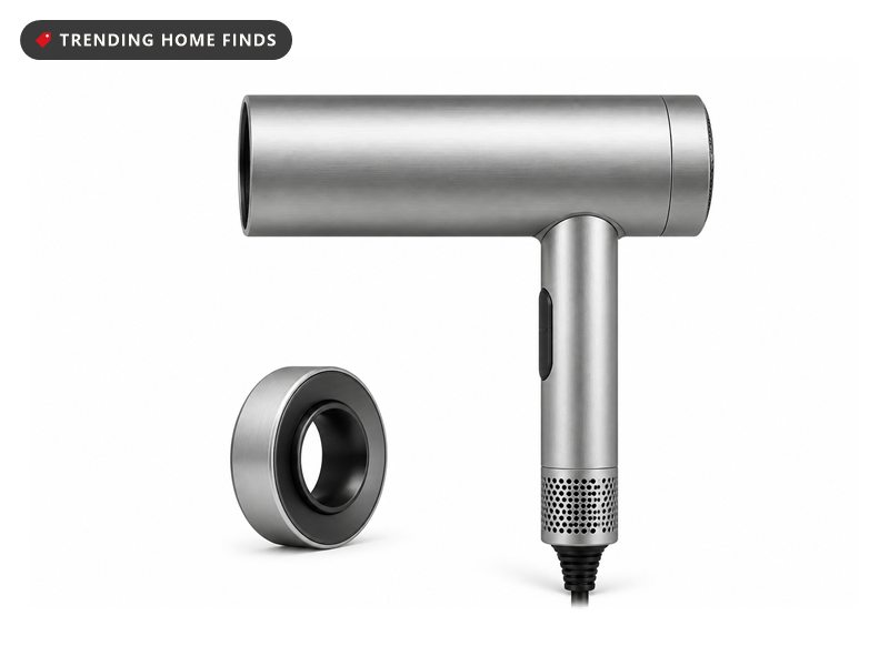 A slim brushed silver high speed hair dryer with a straight handle and its round magnetic nozzle beside it.
