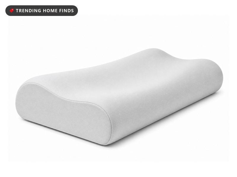 A white contoured memory foam pillow with a hollow center in a light gray cooling case.