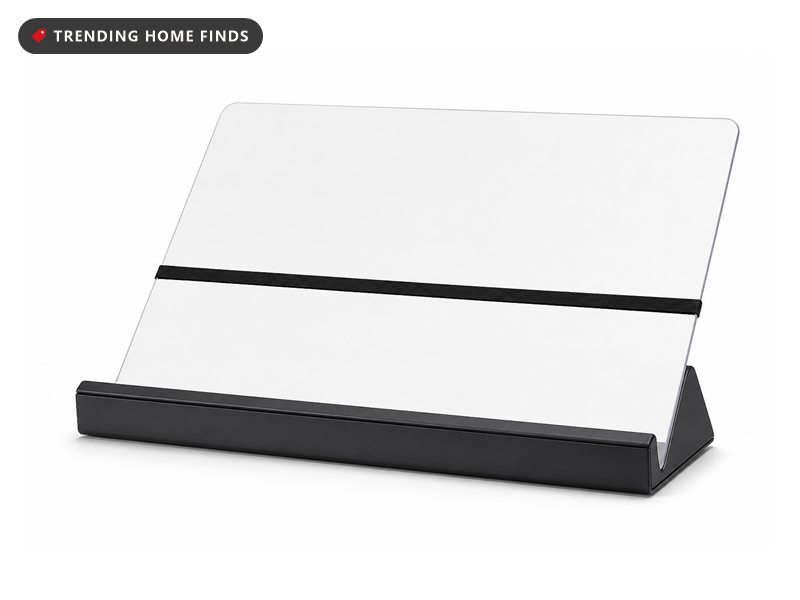 A black and clear in-line document holder with a sloped panel, a bottom ledge and an elastic band.