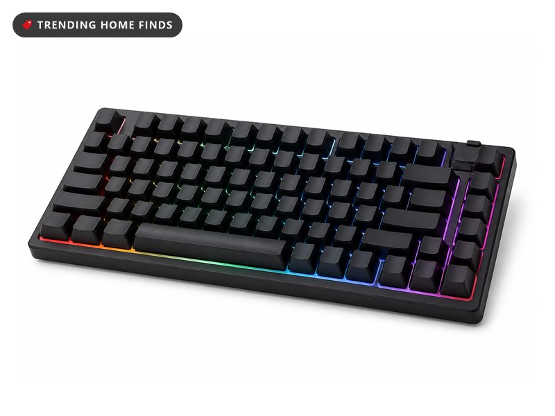 A black tenkeyless mechanical keyboard with blank keycaps and RGB light glowing between the keys.