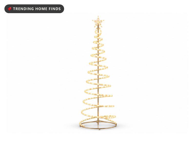 A six foot spiral Christmas tree of warm white LED lights around a slim pole with a crystal star topper, switched on.