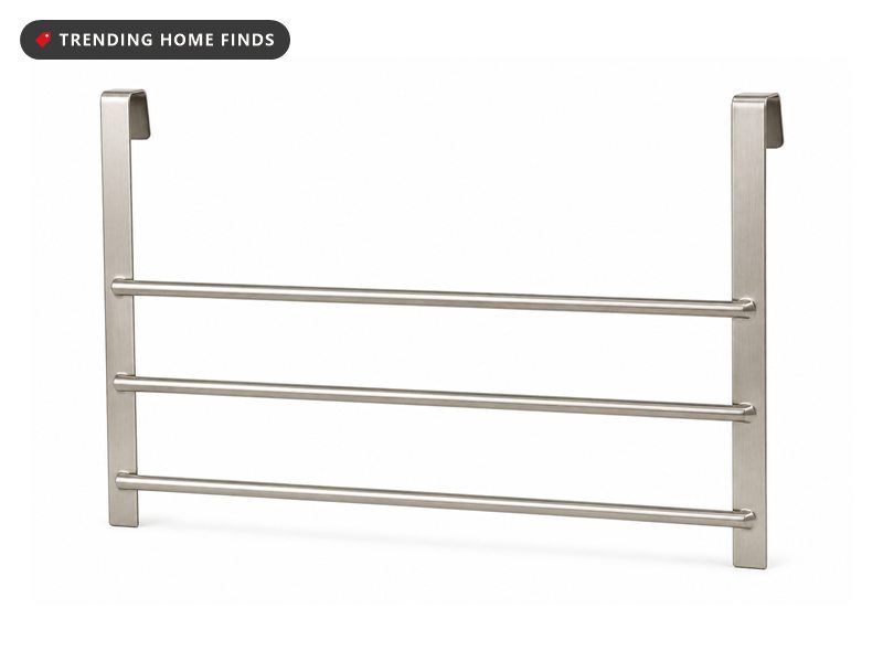 A brushed nickel over the door towel rack with three bars and two top hooks.