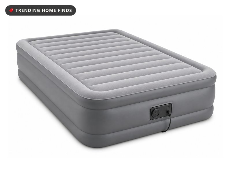 A raised queen air mattress with gray sides, a flocked top and a pump panel on one side.