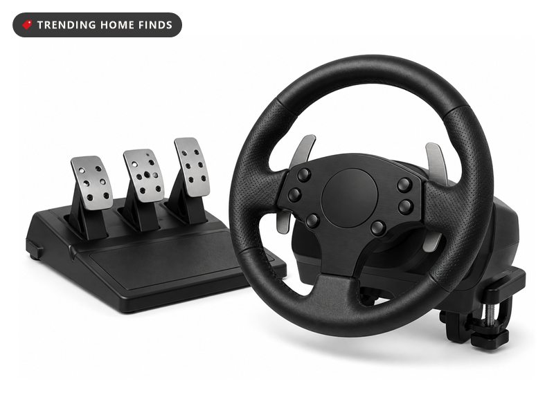 A racing wheel with a leather wrapped rim, steel paddle shifters and a pedal unit with three pedals.