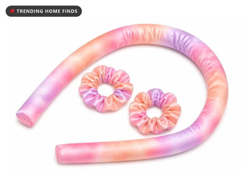 A sunset tie dye satin heatless curling rod with two matching satin scrunchies.