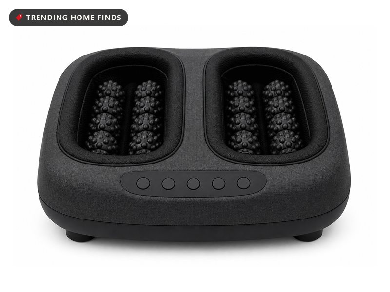 A dark gray fabric shiatsu foot massager with two open foot chambers lined with soft rollers.