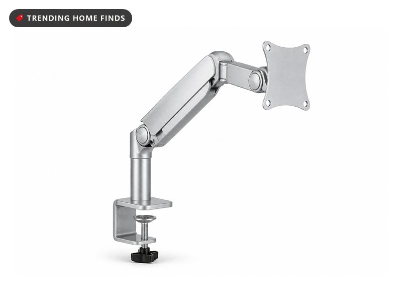 A silver aluminum single monitor arm with a clamp base, gas spring arm and mounting plate.