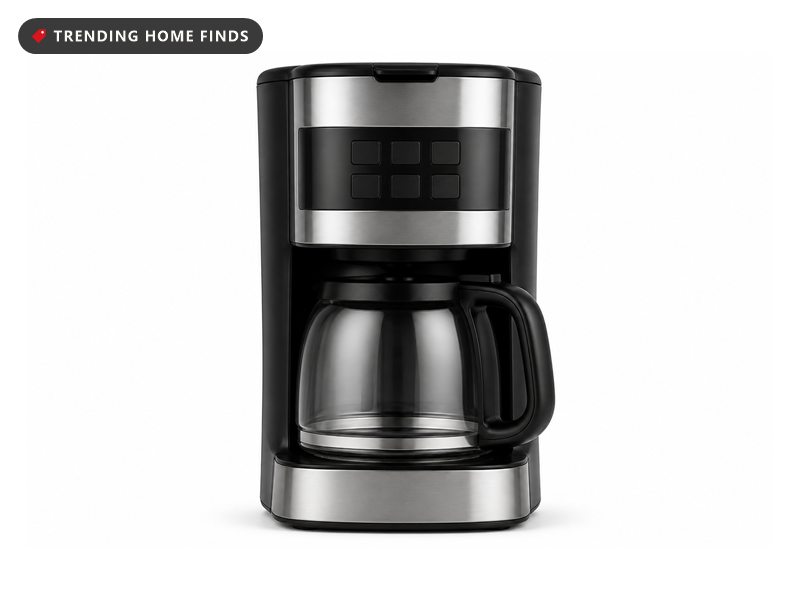 A black and brushed steel drip coffee maker with a glass carafe and a plain control panel.