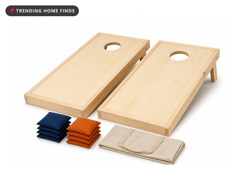 Two natural pine cornhole boards leaning together with eight bean bags stacked in front of them.