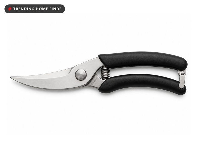 Stainless steel poultry shears with black handles, a spring and a safety lock.