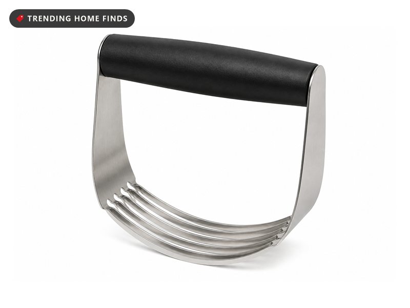 A pastry blender with a black handle joined to a U shaped arc of flat stainless steel blades.