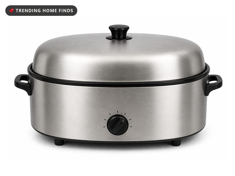 A stainless steel electric roaster oven with a high domed lid, black side handles and a front knob.