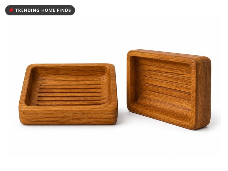 Two teak wood soap dishes with grooved, sloping tops, one set slightly behind the other.