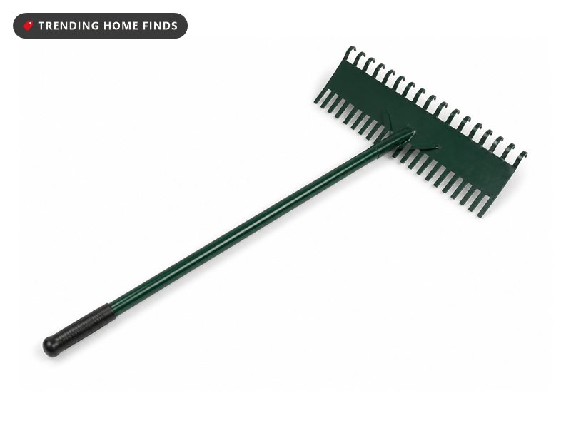 A thatch rake with a wide dark green steel head, curved tines along one edge and a long green handle with a black grip.