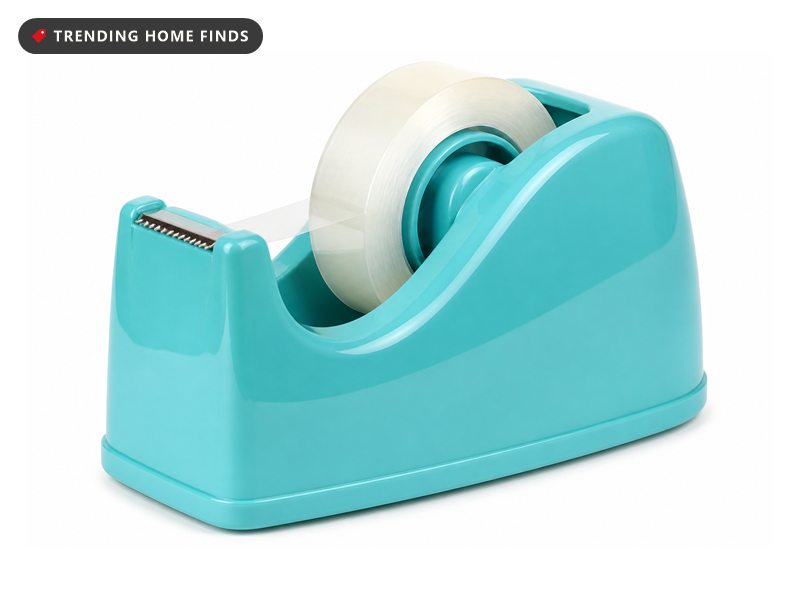 An aqua desktop tape dispenser with a clear tape roll and a serrated cutting blade.