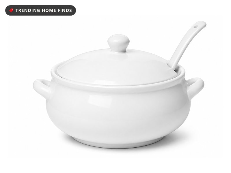 A round white porcelain soup tureen with two side handles, a domed lid and a matching ladle.