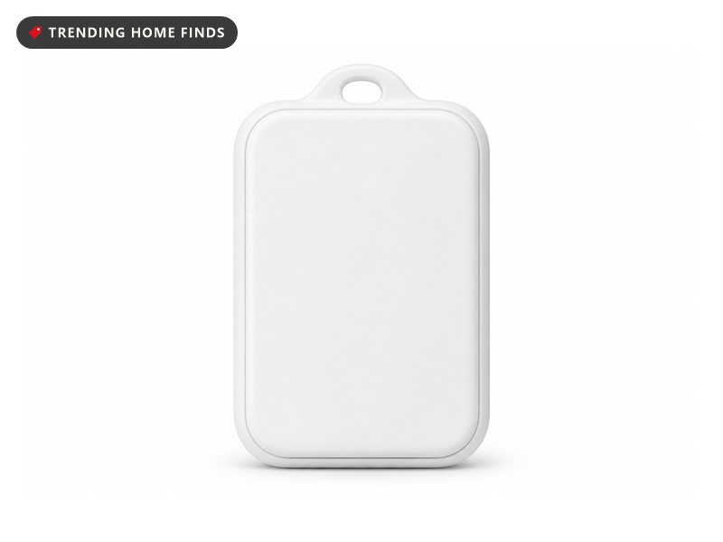 A small white wireless temperature and humidity sensor with rounded corners and a hanging hole.