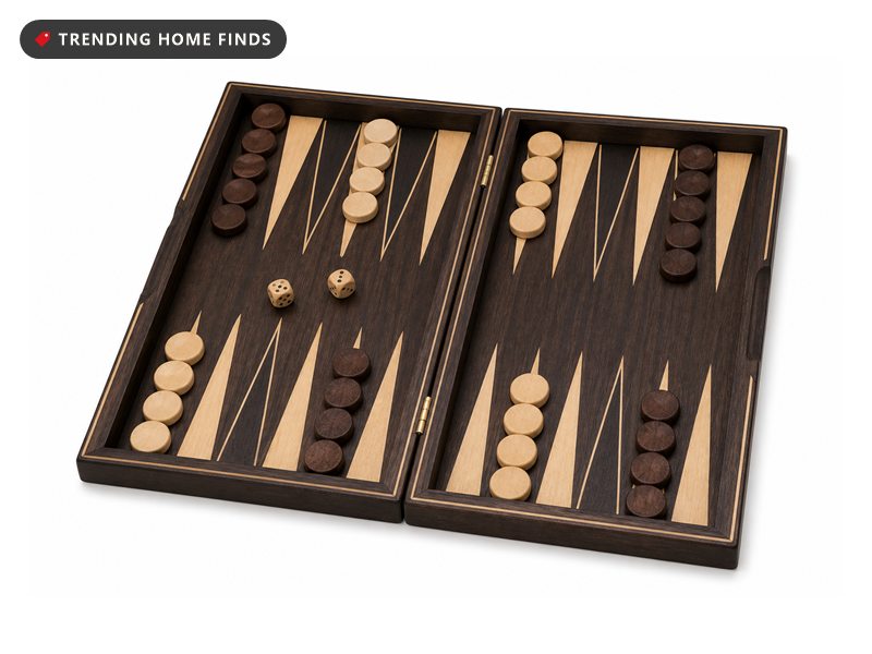 A 17 inch wood backgammon case open flat, showing the inlaid points, wooden checkers and dice.