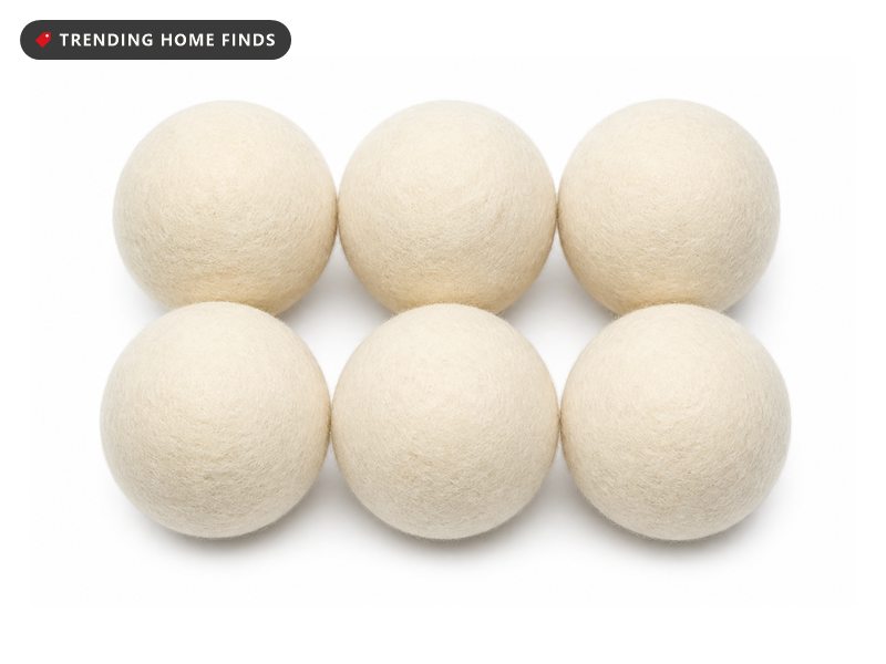 Six cream felted wool dryer balls in two rows of three.