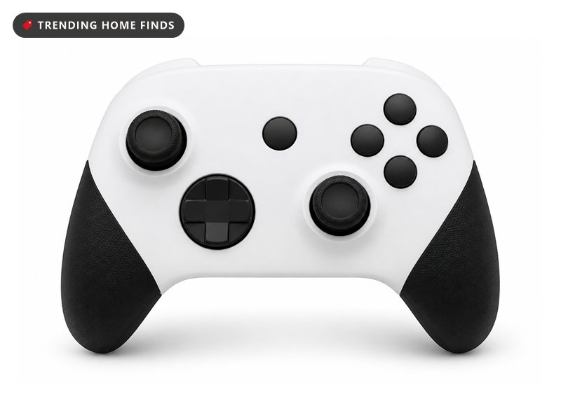 A white wireless gaming controller with black textured grips, two thumbsticks and blank round buttons.